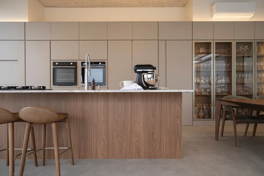 Minimalist desk with a focus on a multipurpose cleaner, office supplies, and storage solutions.